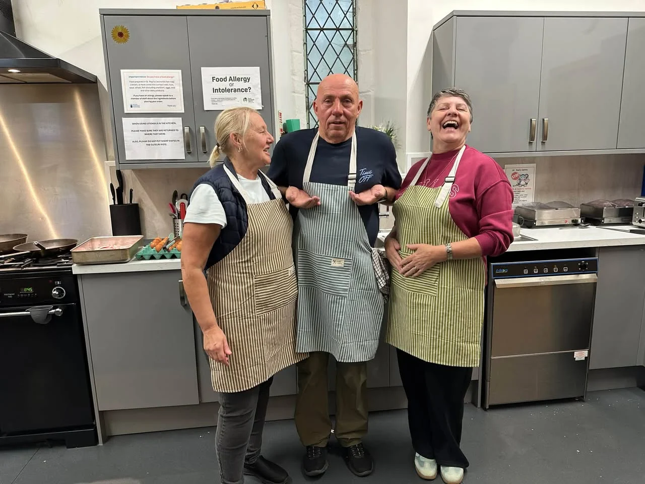 Three members of the kitchen team sharing a laugh at St Paul’s